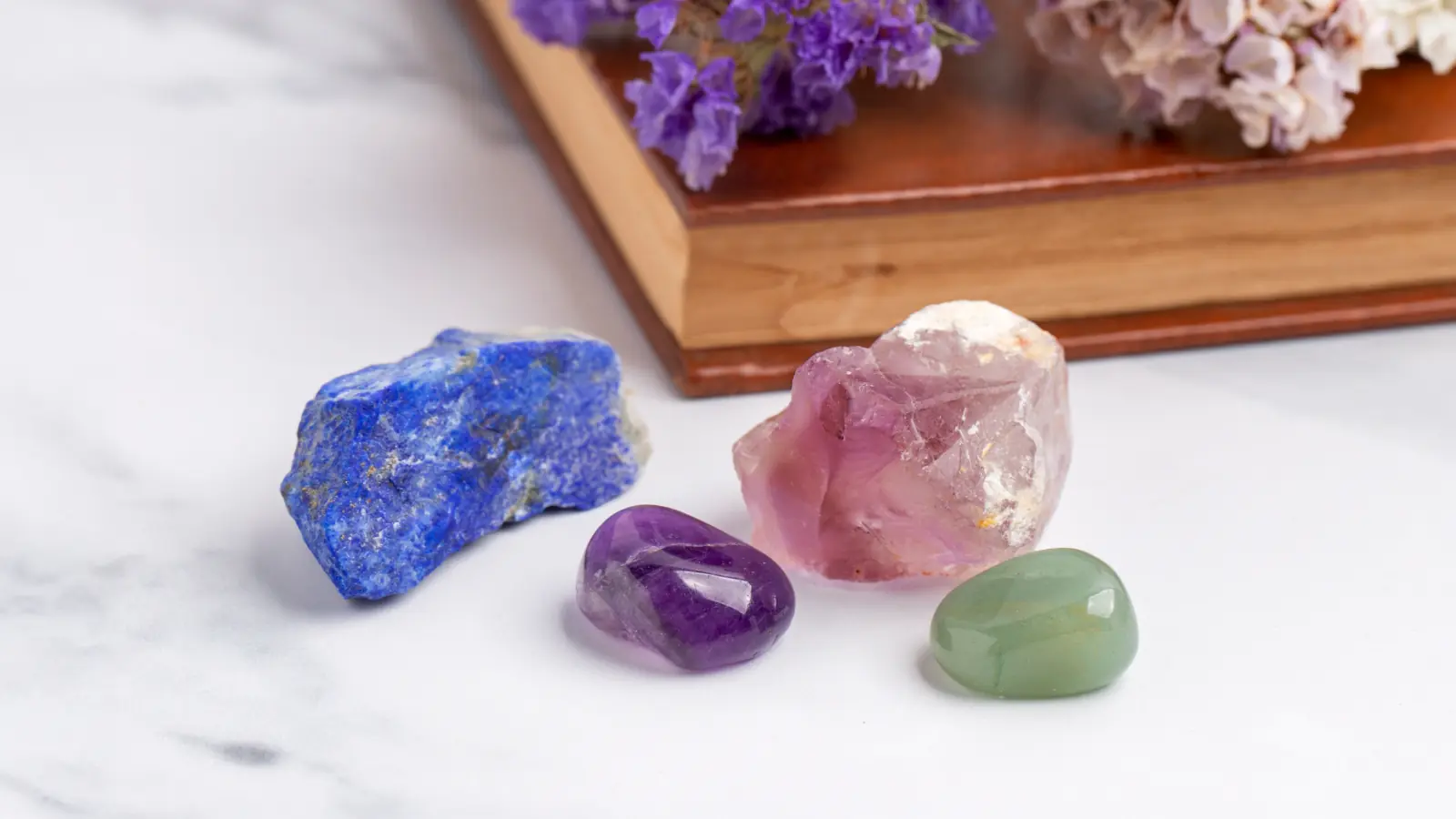 A close-up of a natural crystal stone with sparkling facets and vibrant colors, symbolizing healing energy, balance, and positive vibes.