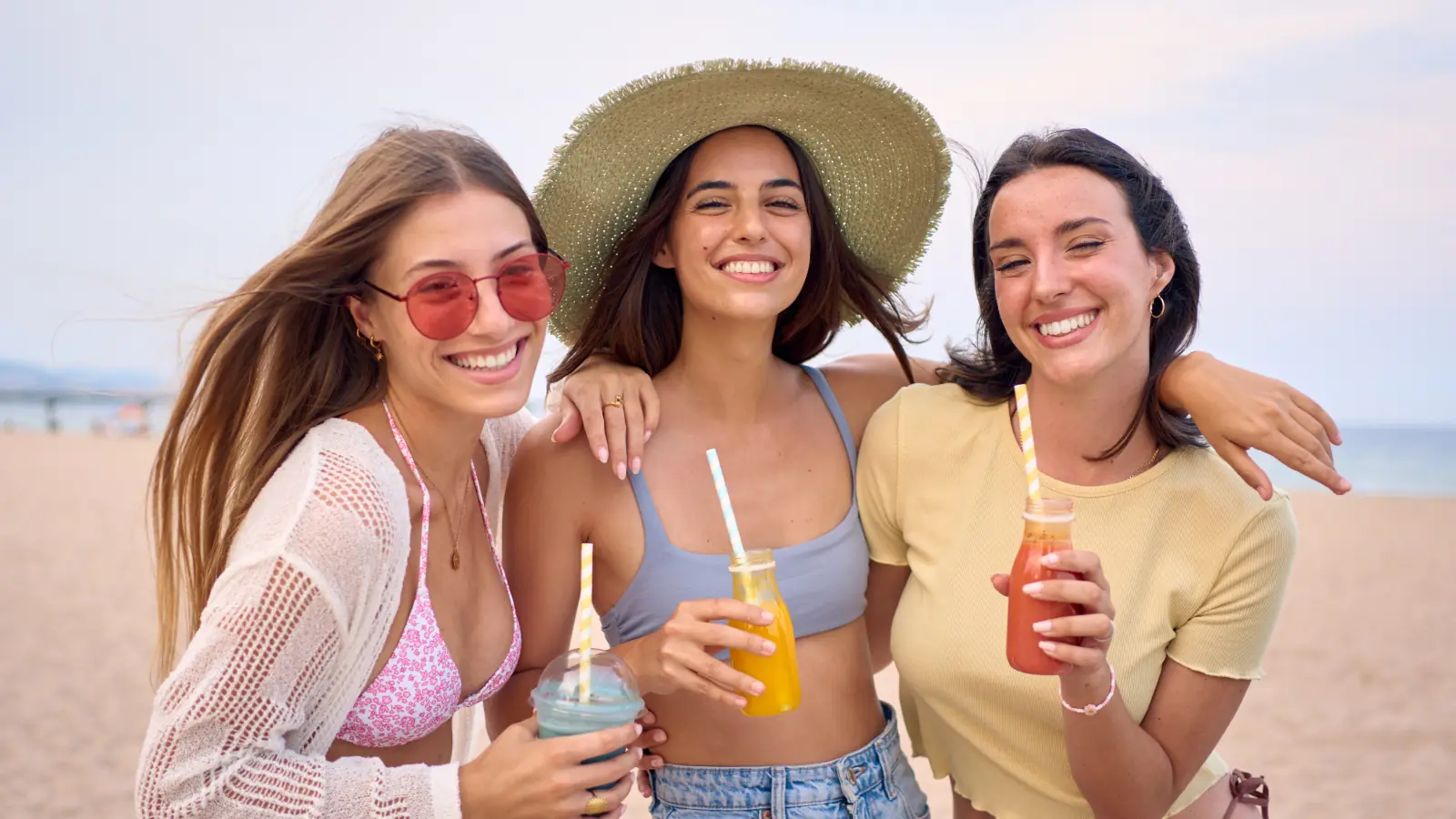 A beautiful young woman with natural makeup smiling softly in bright daylight, representing confidence, elegance, and youthful beauty