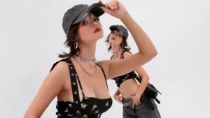 A fashionable young woman with natural makeup and a confident pose, wearing a minimalist outfit that reflects effortless modern style.